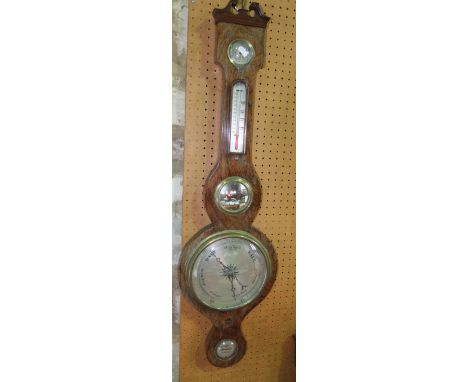 A 19th century rosewood wheel barometer with silvered dials and further mirror panels