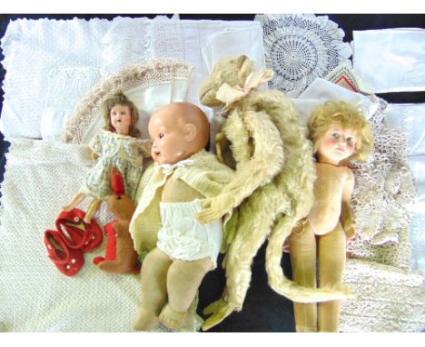 A box containing an assortment of vintage dolls to include an early mid-20th century felt work doll with jointed body and pai