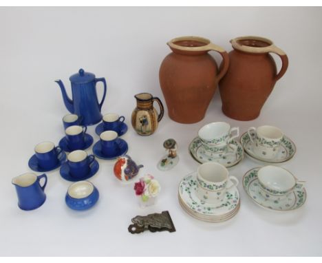 A collection of early 19th century tea wares with blue cornflower and green leaf border decoration including a pair of coffee