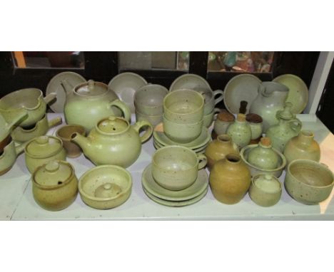 A collection of Winchcombe Pottery and other similar Studio Pottery wares all with speckled brown glaze on an oatmeal coloure