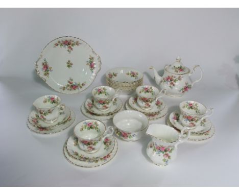 A collection of Royal Albert Moss Rose pattern wares comprising teapot, milk jug, sugar bowl, cake plate, five cups, five sau