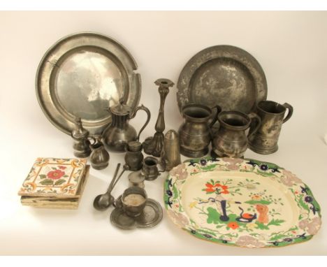 Two large old pewter plates together with further antique pewter tankards, a ewer, cups etc also together with a selection of