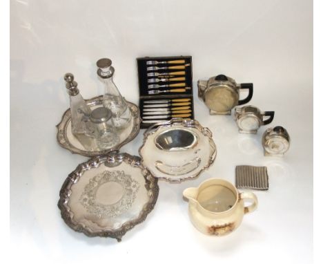 Silver plated wares to include a bowl with hinged handle on a pedestal base, two trays of circular form, a clear cut glass de