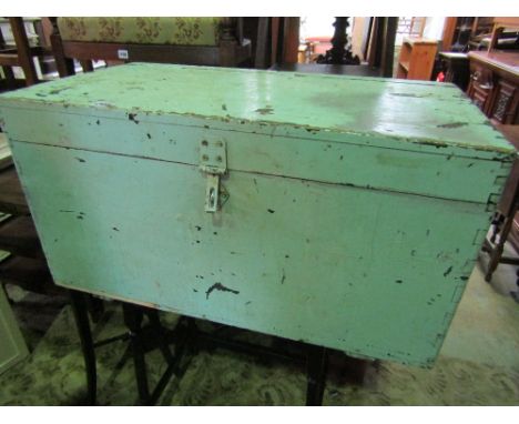 A vintage green painted pine box with hinged lid and iron work side carrying handles