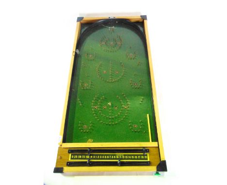 A boxed Bagatelle board with painted detail