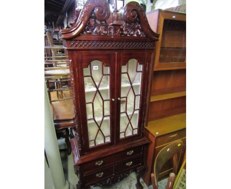 A small reproduction hardwood Chippendale revival side cabinet, the upper section with broken swan neck pediment and blind fr