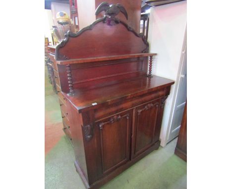 A Victorian mahogany chiffonier with plum pudding and flame veneers, raised arched back with eagle surmount and shallow shelf