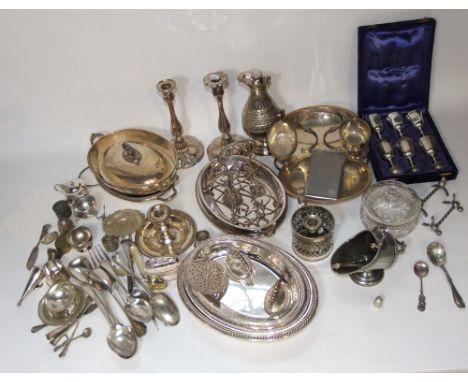 A collection of silver plated wares to include good quality lidded tureens of oval form, a pair of candlesticks, chamber stic