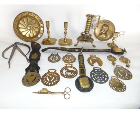 Antique and later brassware to include a complicated ornate candlestick raised on three paw supports with sprung stem and emb