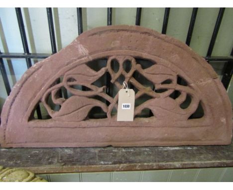 A small red sandstone architectural and ornamental arch with scrolling pierced foliate detail, 90cm x 45cm approx