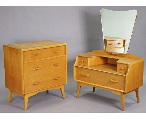 A mid-20th century E. Gomme G-Plan light oak bedroom pair comprising of a small chest of three long graduated drawers, 76cm w