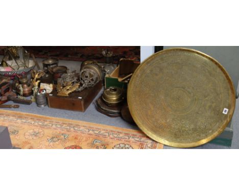 An eastern brass engraved circular tray, 58cm diameter; a pewter charger, 42cm diameter; two ceiling light fittings; &amp; va