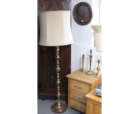 A gilt frame circular wall mirror with a sphere border, 38.5cm diameter; together with a brass standard lamp; various table l