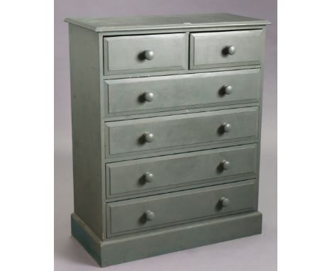 A light green painted pine chest fitted two short &amp; four long drawers with turned knob handles, &amp; on a plinth base, 8