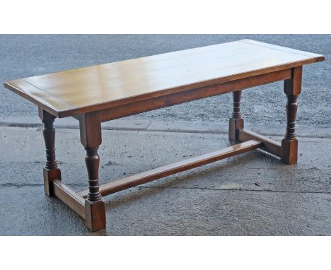 An oak refectory table with a rectangular top, &amp; on four baluster turned legs with plain stretchers, 200cm long x 77.75cm