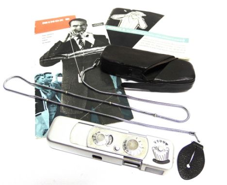 A MINOX B SUBMINIATURE CAMERA  in its leather travel case. 