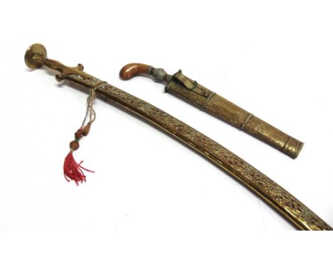 MILITARIA - AN INDIAN TALWAR (SWORD)  the 64cm curved blade unmarked, with a brass hilt, in a pierced brass scabbard, overall