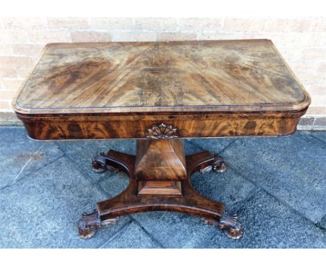 A WILLIAM IV FIGURED MAHOGANY CARD TABLE  shaped pillar support with quatrefoil base, 92cm wide 