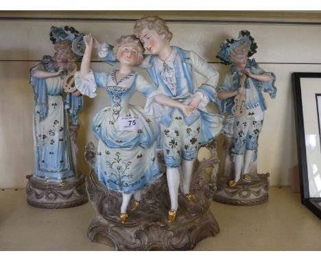 A bisque group modelled as a beau dancing with his companion also a pair of bisque musician figures.   CONDITION REPORT:  35c