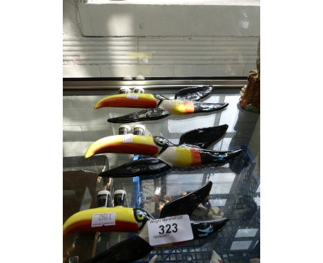 Three graduated Carltonware Guinness advertising flying toucan wall plaques.