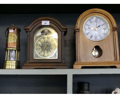 A reproduction brass and copper miner's lamp, and two modern bracket clocks.