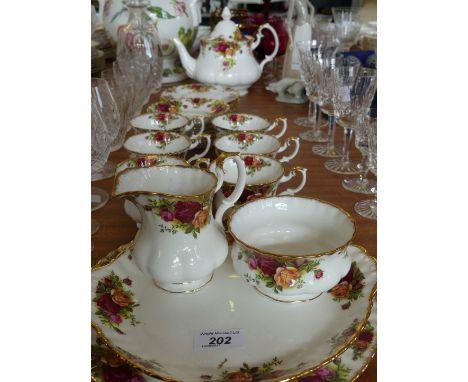 A Royal Albert Old Country Roses twenty-three piece tea service, comprising teapot, six cups and saucers with side plates, sa