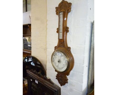 A 20th Century carved oak banjo barometer/thermometer.
