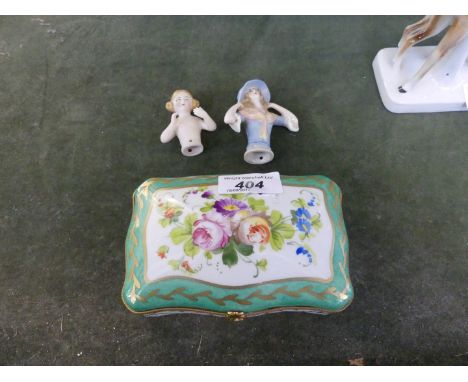 A reproduction hand painted lidded trinket box, together with two Vintage pin cushion dolls.