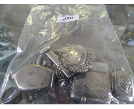 A collection of assorted silver and white metal items to include a chased decorated vesta case, white metal patch box, silver