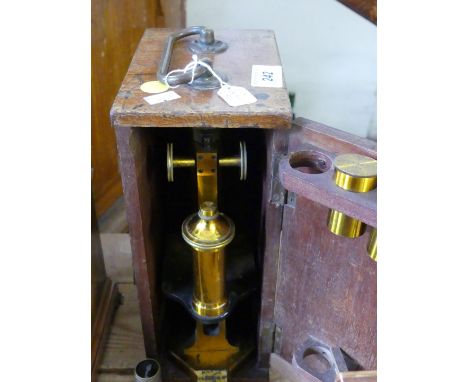 A mahogany cased R & J Beck of London microscope, impressed no. 23427, complete with additional lens.