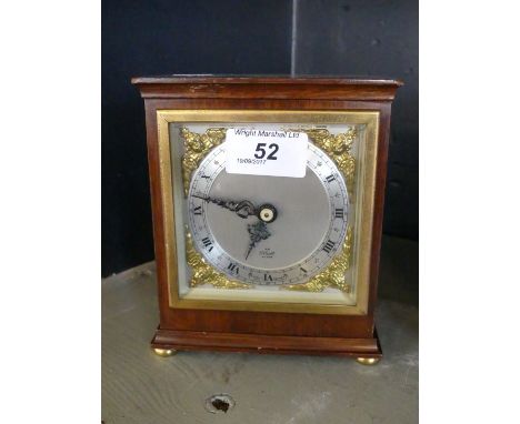 A 20th Century mahogany cased Elliott mantel clock, with silvered dial and applied gilt metal spandrels. 
