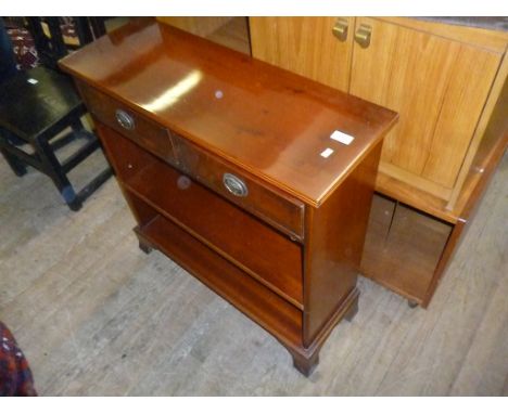 A Georgian style reproduction satinwood bookcase, the top with inlaid stringing decoration, two small drawers with brass drop