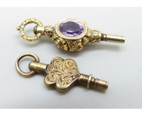 Two watch keys, one set with an amethyst and a red stone 