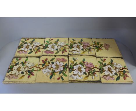 Two sets of five Victorian fireplace tiles (forms a picture of flowers) and one larger tile 