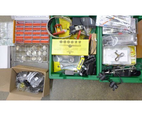 Two trays of mixed watch glasses, clock hands, watch repair items including several eye magnifiers and a case back tool for R