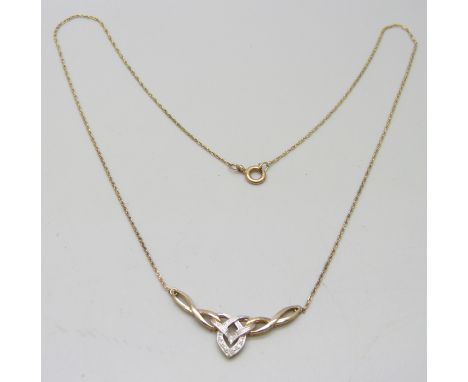 A 9ct gold and diamond Celtic style necklace, 2.4g 