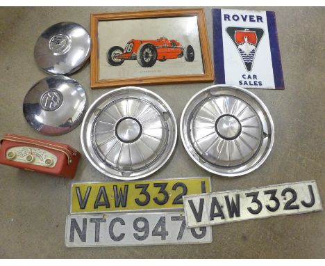 Motoring; four hub caps, event banners, two sets of vintage car number plates, Bugatti mirror, Rover car sales sign and a Rob