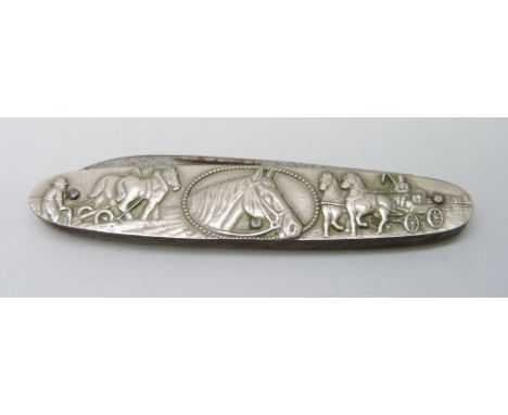 A vintage pocket knife with horse and gun dog detail 