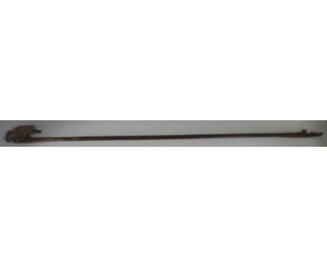 An early Egyptian stick with carved bird top 