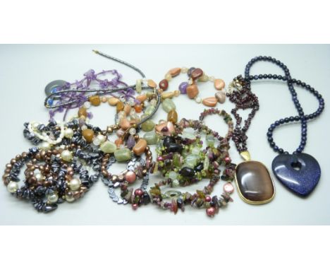 A collection of gemstone jewellery including blue goldstone and amethyst 