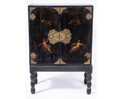 An 18th Century Italian black lacquer and decorated cabinet on a later stand:, painted with cherubs and classical figures in 