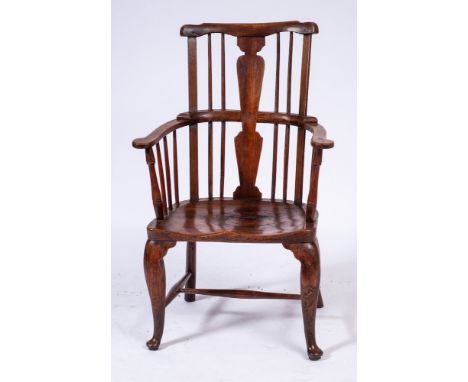 An 18th Century elm and fruitwood comb back Windsor elbow chair:, the back with shaped top rail and solid central vase-shaped