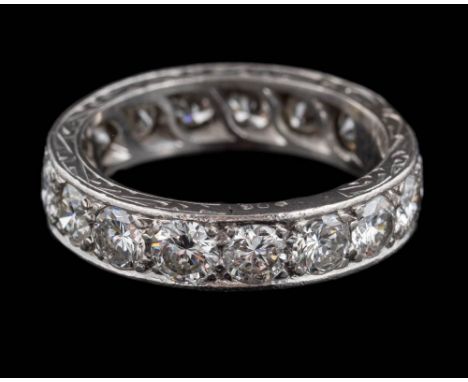 A diamond eternity ring: pave-set with sixteen round, brilliant-cut diamonds estimated to weigh a total of 3.70cts, ring size