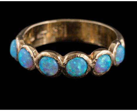 A 9ct gold and simulated opal six-stone ring: of hammered design, the shank stamped 'BR' and with continental markings, appro