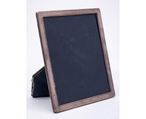 An Elizabeth II silver easel photograph frame, maker P H Vogel &amp; Co, Sheffield, 1991: of rectangular outline, 28.5 x 23.5