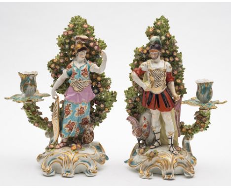 A pair of large Continental candlestick figures of Mars and Minerva: after Chelsea originals, with floral bocage backgrounds,