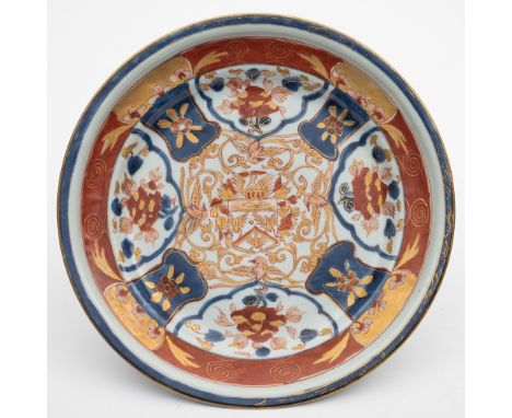 A Chinese Imari armorial serving dish for the Dutch market: with ogee moulded rim, painted in underglaze blue, iron-red and g