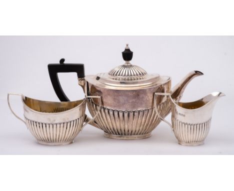 A late Victorian three-piece tea service, maker Mappin Brothers, Sheffield, 1896/98: of oval outline with half reeded decorat