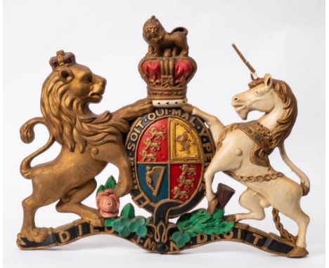 A cast metal and polychrome decorated Royal Coat of Arms:, 70cm wide.