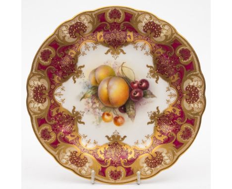 A Royal Worcester fruit painted cabinet plate by Richard Sebright: the centre painted with peaches, grapes and blossom, the b